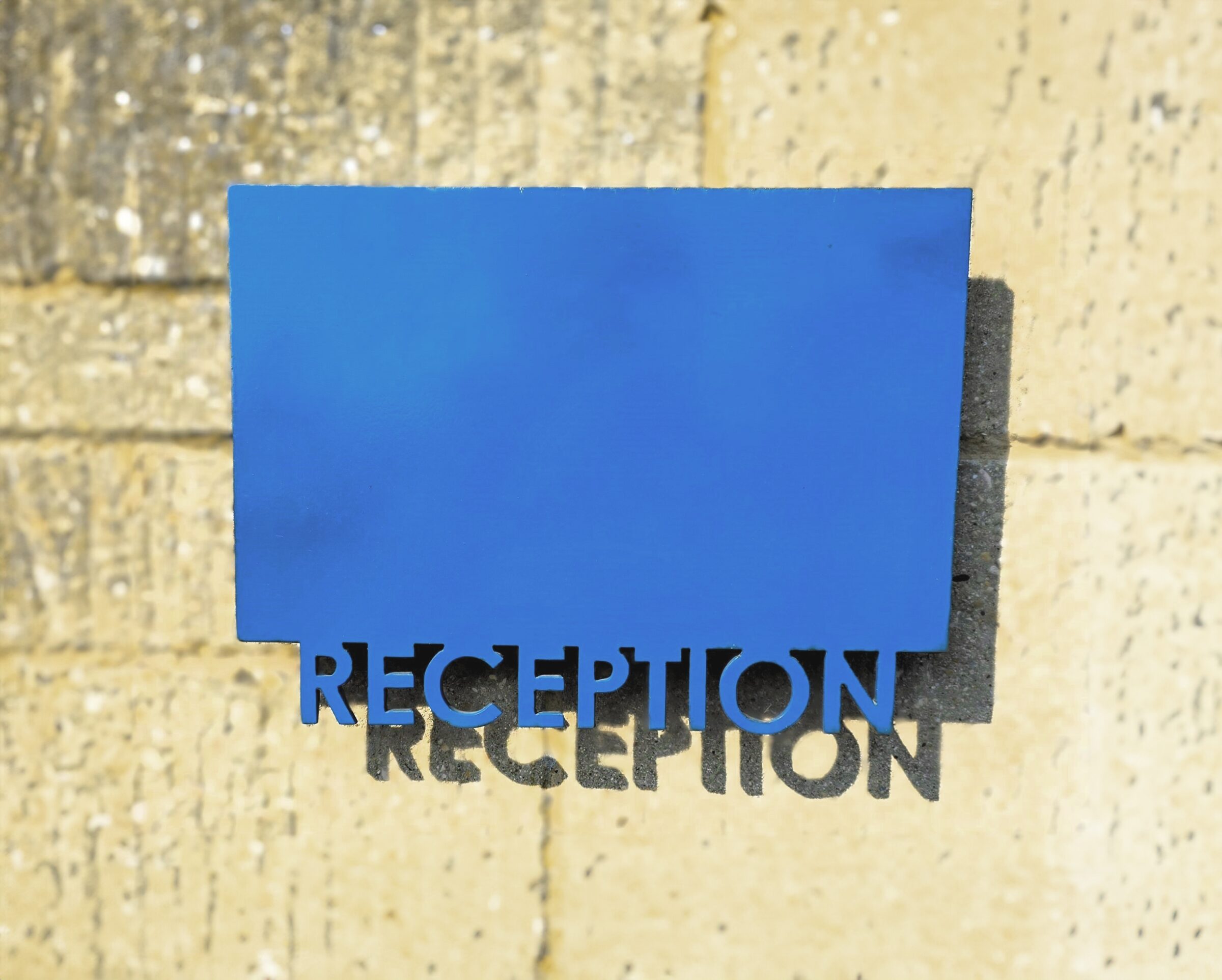 Blue painted steel reception sign